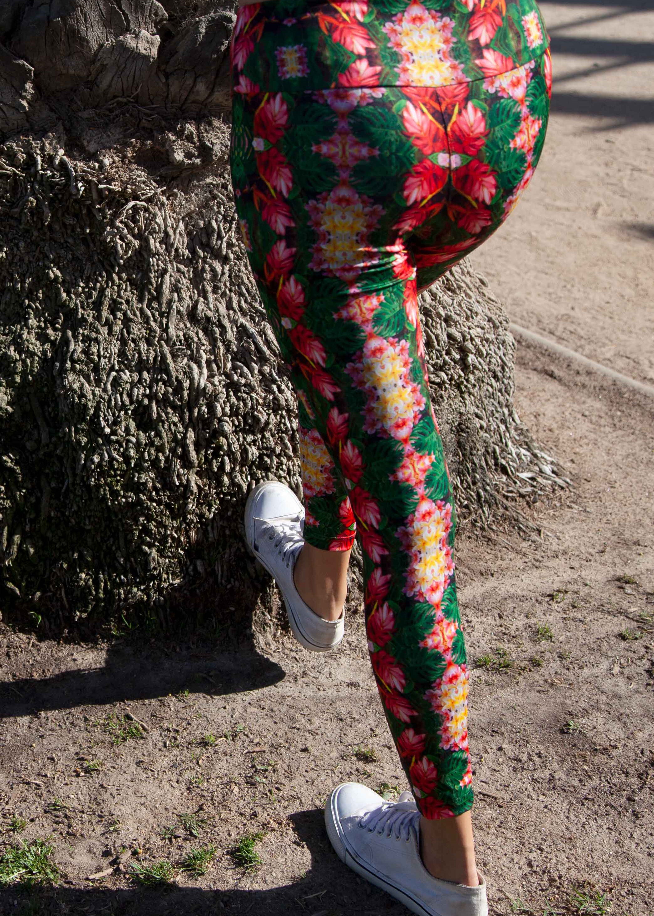 Printed floral leggings. Tropical flowers and plants collaged into this gorgeous unique print. UPF 50 sun protecting fabric. Sustainably made from recycled fabric.